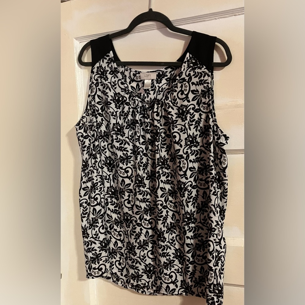 Love the flow of this sleeveless gem. A great look with jeans or dress pants.